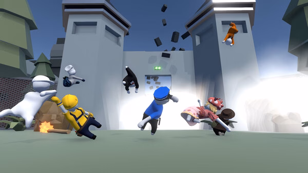 Screenshot from Human Fall Flat showing colorful characters in mid-air near a crumbling wall, with scattered debris.