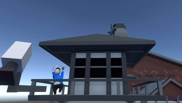 A 'Human Fall Flat' screenshot of a character in a blue outfit climbing a railing near a building with a chimney.
