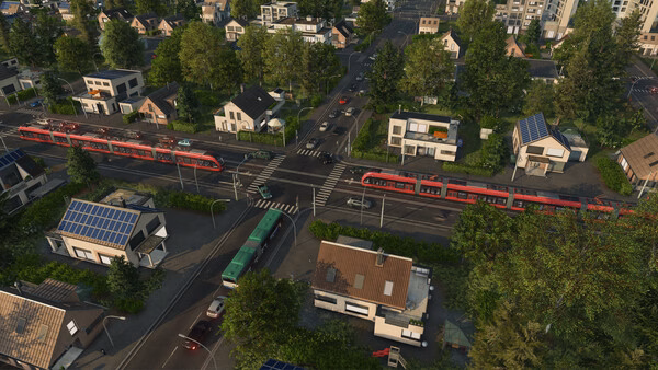 Screenshot from Transport Fever 3 showing a vibrant city intersection with trains, buses, and houses surrounded by greenery.