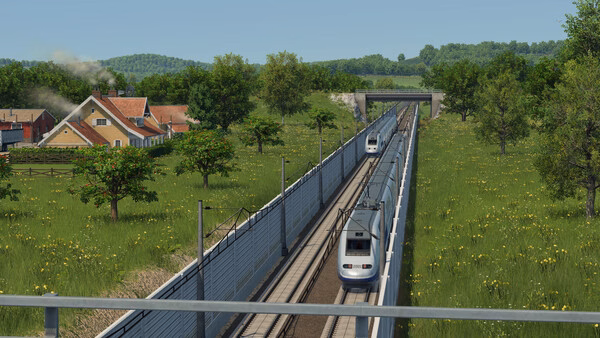 Transport Fever 3 screenshot: A modern train travels on tracks through a green countryside with houses, trees, and a bridge in view.