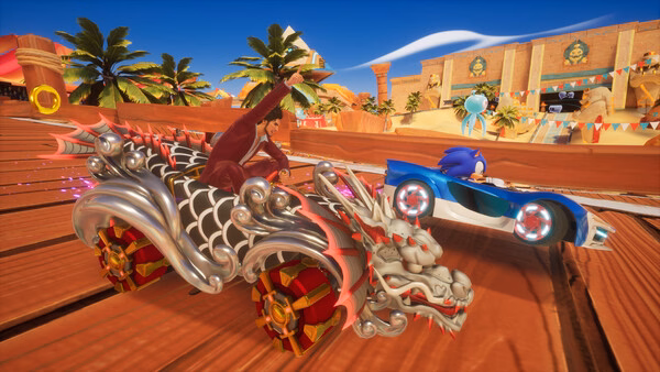 Screenshot of Sonic Racing: CrossWorlds showing Sonic in a blue car racing against a dragon-themed vehicle on a sunny track.