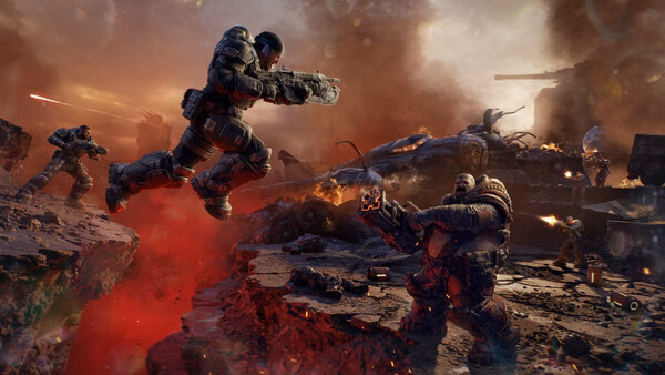 Screenshot from Gears of War: E-Day showing an intense battle scene with soldiers fighting amidst a fiery, war-torn landscape.